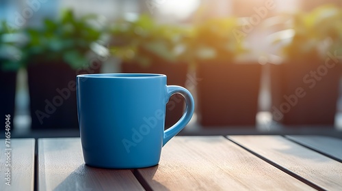 Balcony View of a blue Mug on a wooden Table. Close up with a blurred Background