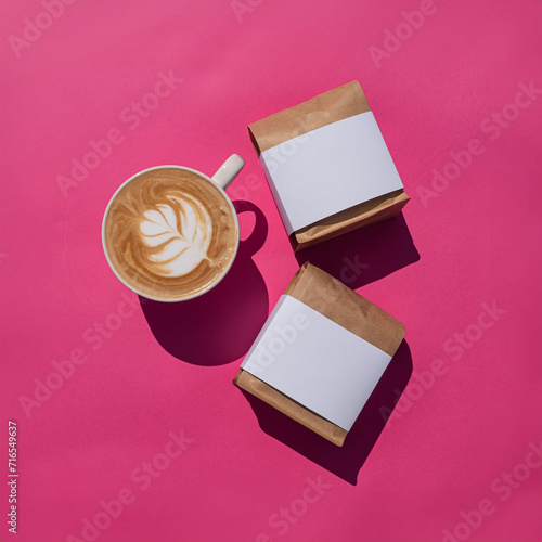 Coffee paper bag mockup with white label. Pink background. Product packaging flatlay