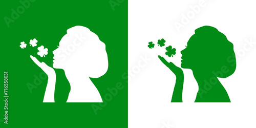 Día de San Patricio. Símbolo de suerte. Silueta de mujer tirando un beso con treboles para su uso en felicitaciones y tarjetas