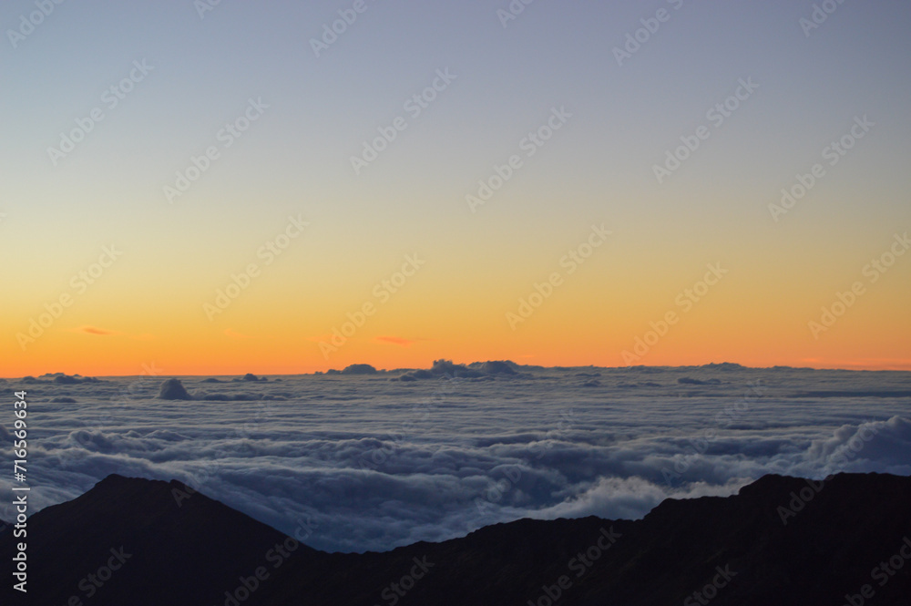 Sunrise Above the Clouds on Volcanic Landscape Sunrise Above the Clouds on Volcanic Landscape