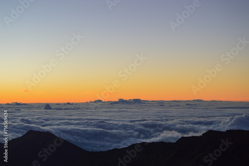 Sunrise Above the Clouds on Volcanic Landscape