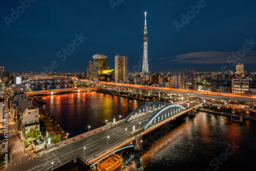 Tokyo cityscape with architectural landmark Tokyo Skytree and Sumida river at night in Tokyo  Japan. 