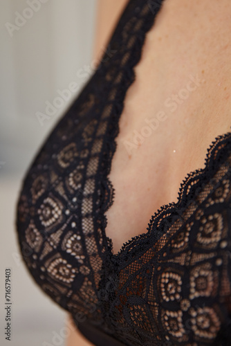 Women's breasts in a beautiful black lace bra
