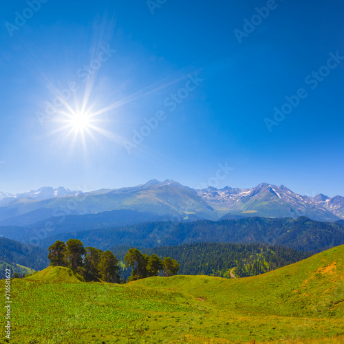 bautiful green mountain valley under a sparkle sun