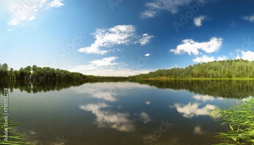 sky reflects from lake at summer day © Lucia