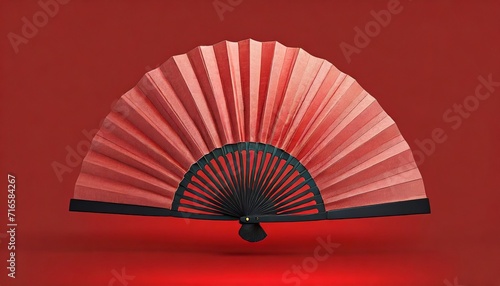 chinese folding fan on red background