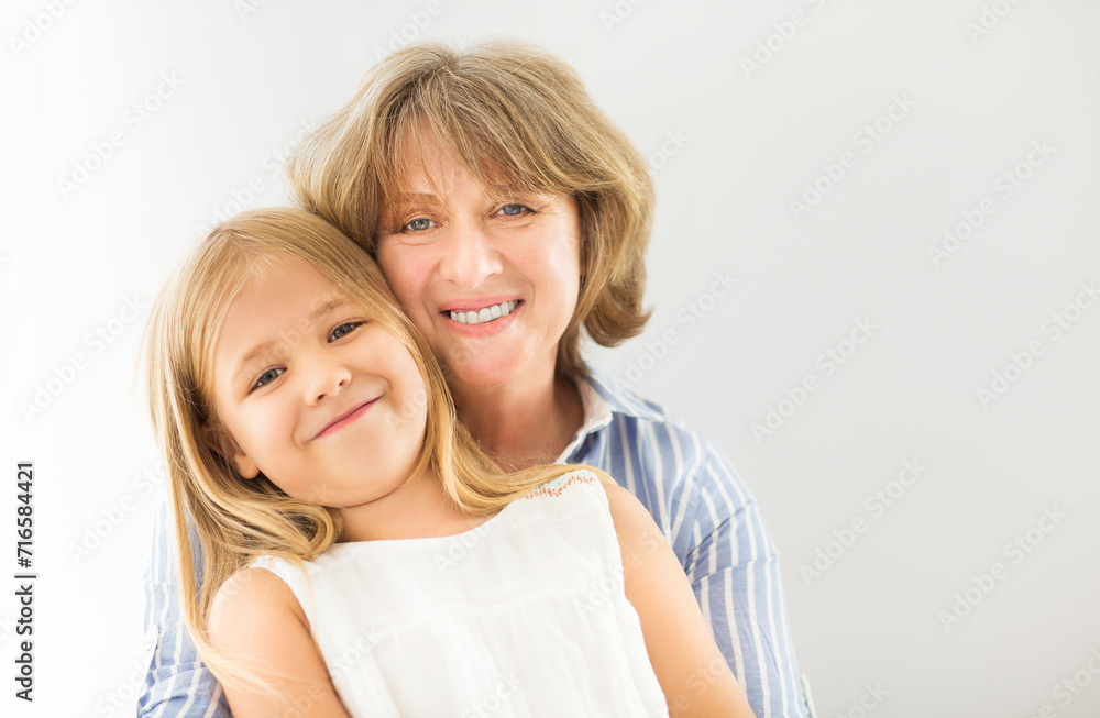 Mature woman embrace with young girl Mature woman embrace with young girl