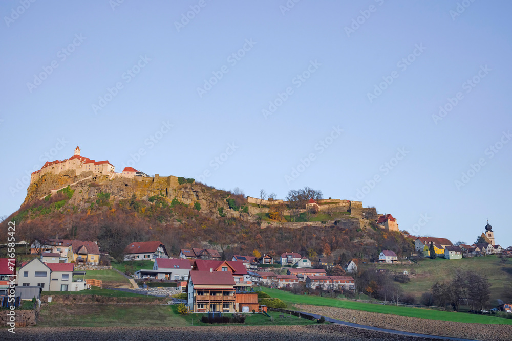 The medieval Riegersburg Castle on top of a dormant volcano, surrounded by charming little village and beautiful autumn landscape, famous tourist attraction in Styria region, Austria