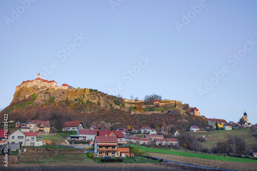Obraz na płótnie The medieval Riegersburg Castle on top of a dormant volcano, surrounded by charming little village and beautiful autumn landscape, famous tourist attraction in Styria region, Austria w salonie