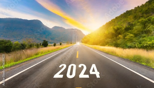 2024 new year road trip travel and future vision concept nature landscape with highway road leading forward to happy new year celebration in the beginning of 2024 for bliss and successful start photo