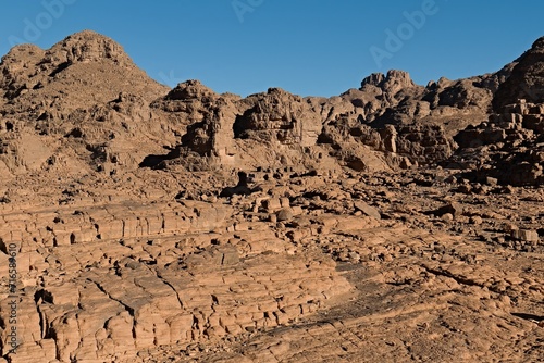 Rock formations at Guelta Tikoubaouine in the tourist area of Immourouden, near the town of Djanet. Tassili n Ajjer National Park. Sahara desert. Algeria. Africa.