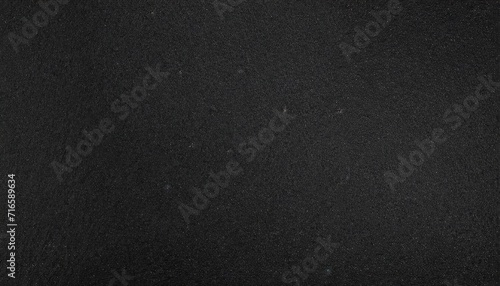 black or dark gray rough grainy sand texture background photo