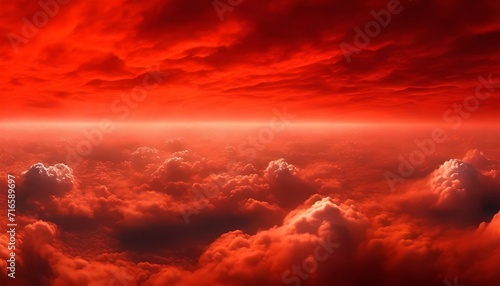 thick clouds on the surface of the earth in the red sky