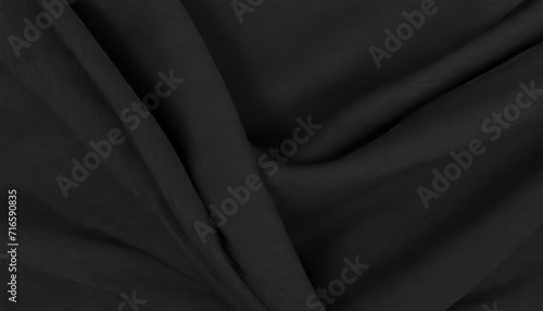 black cloth fabric in soft folds top view photo