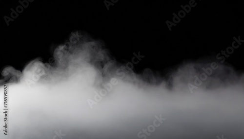 a cloud of white smoke on a black background thin smoke some areas of which seem thicker than othersthick fog that expands over the surface