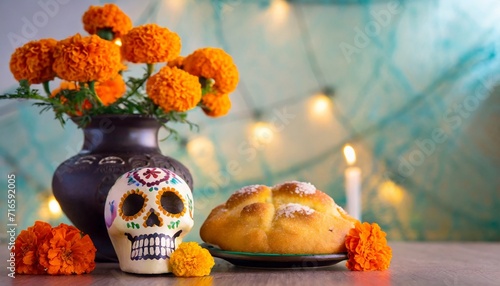 day of the dead dia de los muertos celebration background with marigolds or cempasuchil flowers in vase with skull bread of death or pan de muerto with copy space traditional mexican culture photo