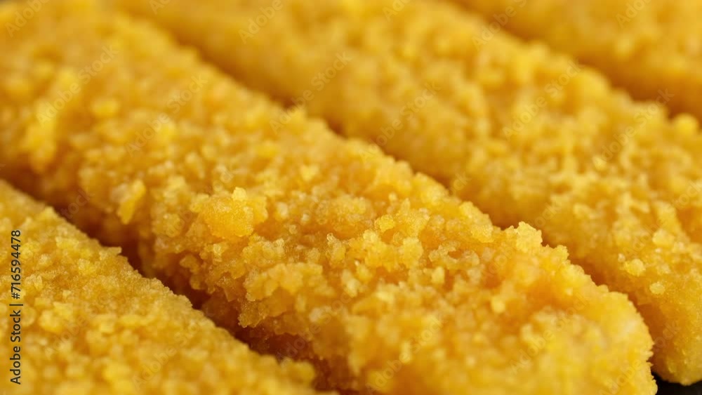 Fresh fish fingers macro isolated on black background, slider shot Fresh fish fingers macro isolated on black background, slider shot