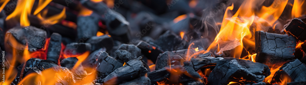 Burning firewood and coals of a fire close up. Background for grilled food with fire. Burning firewood and coals of a fire close up. Background for grilled food with fire.