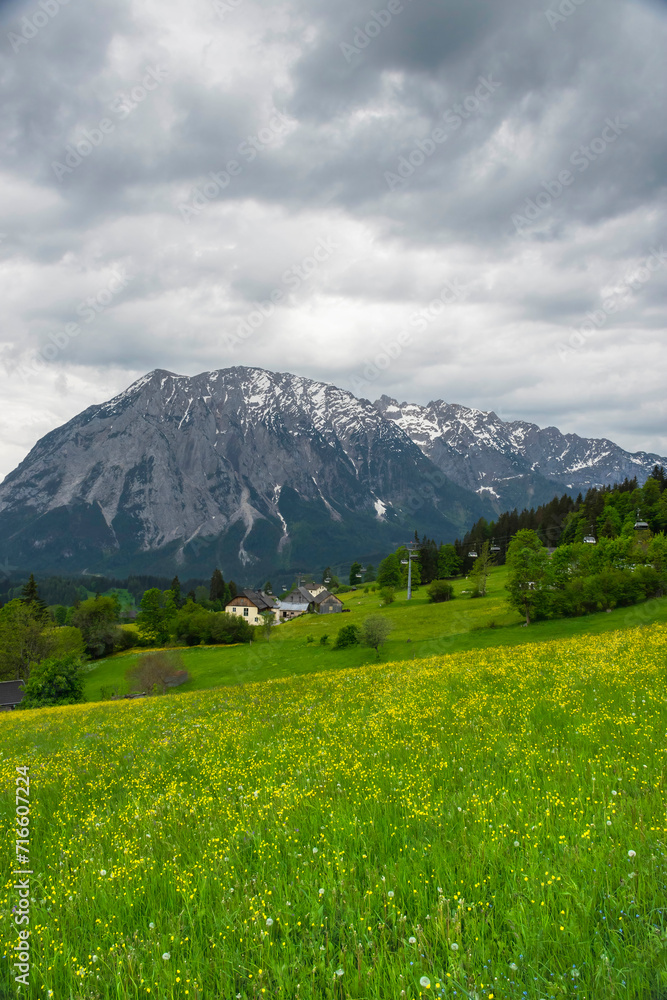 Summer austrian landscape with Grimming mountain (2.351 m), an isolated peak in the Dachstein Mountains, view from small alpine village Tauplitz, Styria, Austria