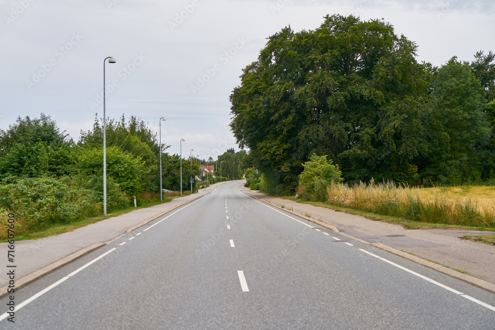 Empty road or street with sidewalk in rural Sweden Empty road or street with sidewalk in rural Sweden