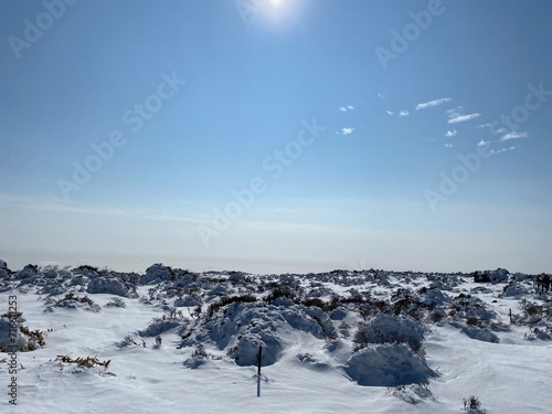 It is a snowy landscape on a mountain with a blue sky.  © DONGKEUN