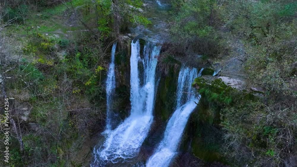 Aerial view from a drone of the Peñaladros waterfall around the town of Cozuela in the Angulo Valley. Las Merindades region. Province of Burgos. Spain. Europe Aerial view from a drone of the Peñaladros waterfall around the town of Cozuela in the Angulo Valley. Las Merindades region. Province of Burgos. Spain. Europe
