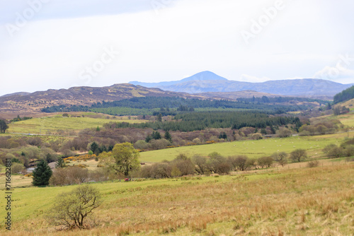 A Tranquil Landscape: Rolling Hills Meet the Distant Mountains