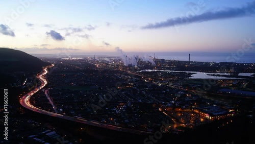 Timelapse of Port Talbot Night to day featuring Tata Steel, the M4 motorway, vehicles and Residential areas photo