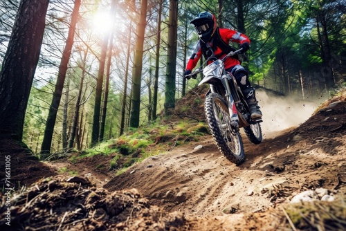 Motocross rider in action on a muddy road at sunset. Motocross. Enduro. Extreme sport concept.