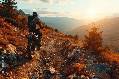 Motorcyclist riding on the trail in the mountains at sunset. Motocross. Enduro. Extreme sport concept.