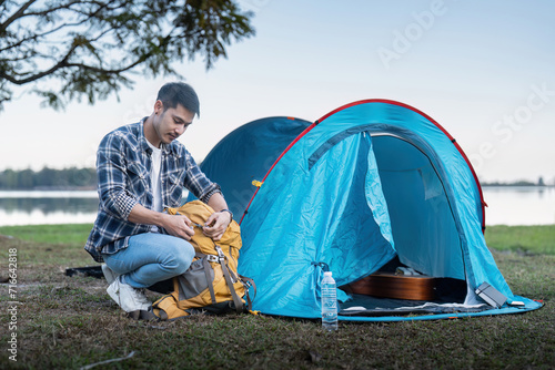 Fotografía Man asian traveling with tent camping on mountain top outdoors adventure lifesty