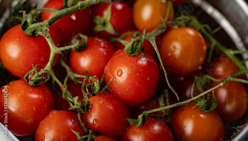 Cherry tomatoes in metalware  red vegetables. Fresh natural organic food  salad ingredient