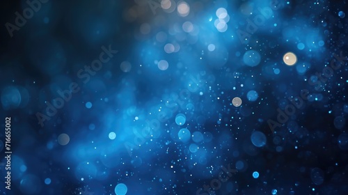 Abstract background with bright highlights of light. Dark blue backdrop with blue and white round light spots  bokeh of different colors  radiance