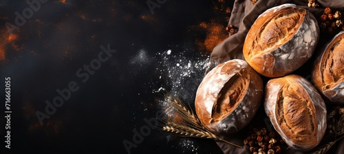 Assortment of freshly baked bakery products on blackboard with copy space, top view