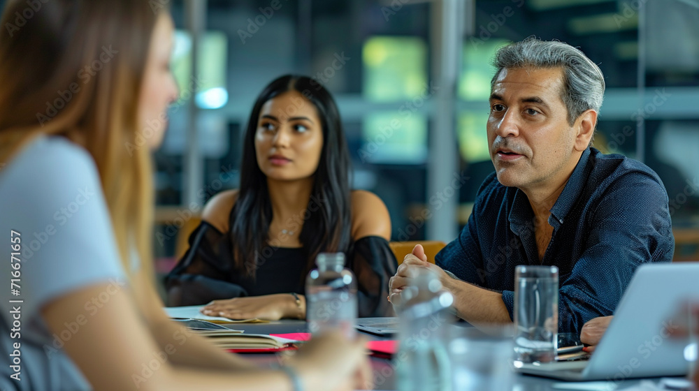 Show the interviewers exchanging glances, nodding, or subtly communicating among themselves, giving a sense of their evaluation process Show the interviewers exchanging glances, nodding, or subtly communicating among themselves, giving a sense of their evaluation process