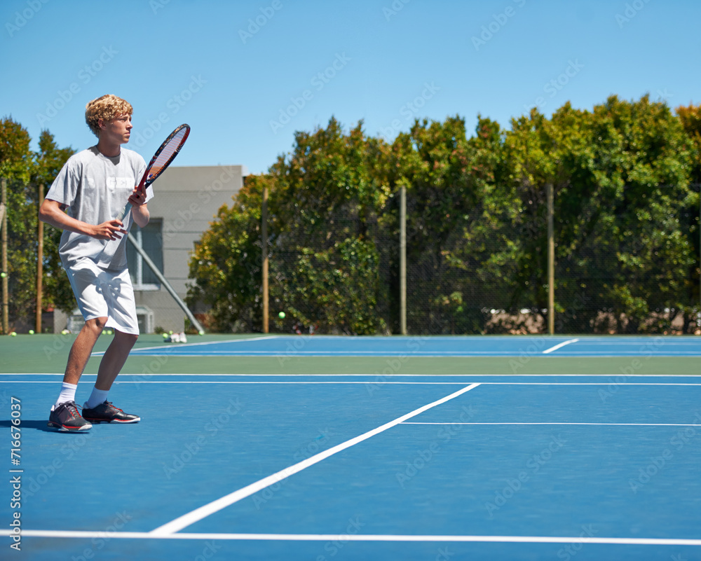 Tennis, sports and teenager with energy, training and performance with competition or workout. Person, player or athlete with racket or court with wellness, activity or game with sunshine or hobby