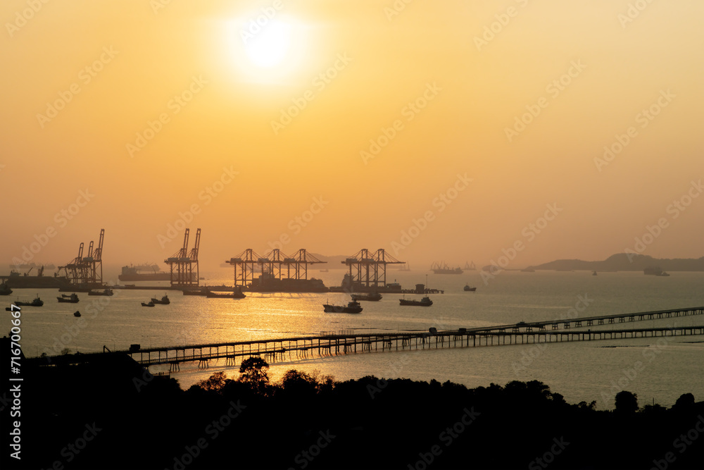 Fototapeta premium the tower crane at the port and logistic systems for transportation.