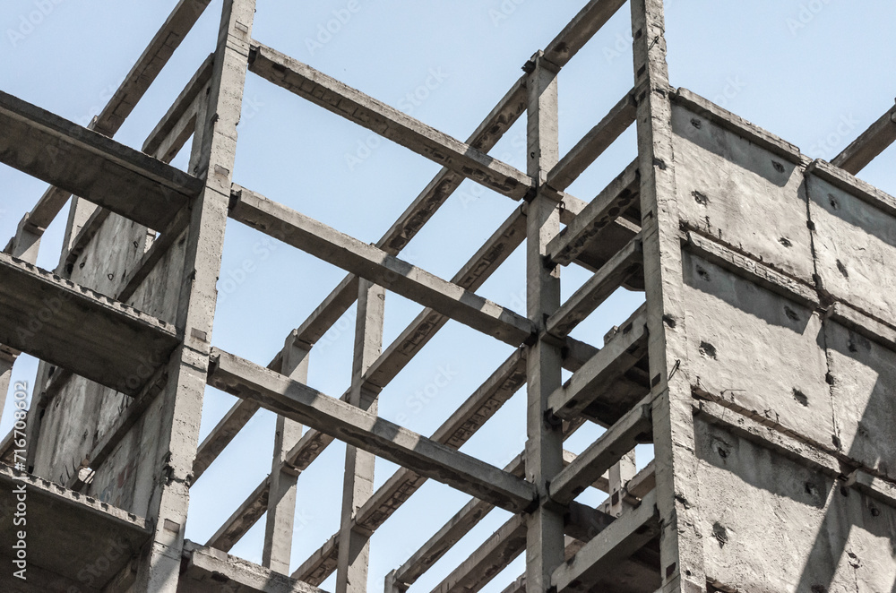 abstract background fragment of a building from concrete blocks on a light background