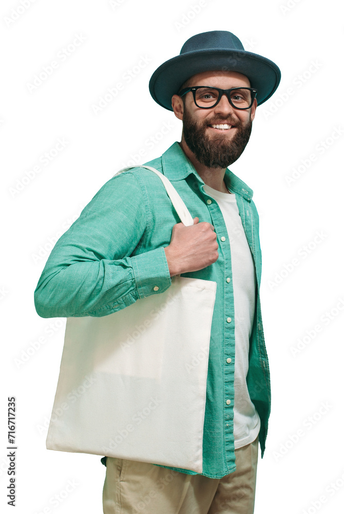 Young man is holding white textile eco bag. Mockup for design Young man is holding white textile eco bag. Mockup for design