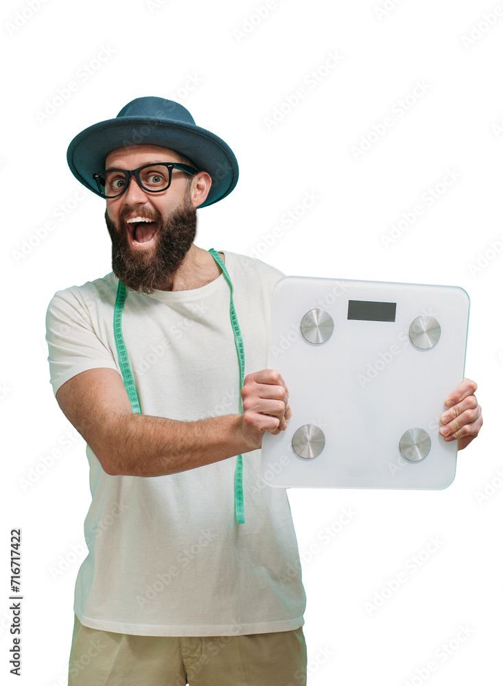 Young bearded charismatic guy nutritionist holding measuring scales, isolated. Diet and healthy lifestyle weight loss concept. Young bearded charismatic guy nutritionist holding measuring scales, isolated. Diet and healthy lifestyle weight loss concept.