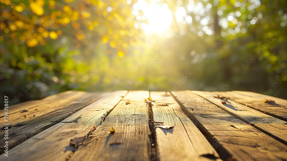 Tranquil Summer Setting: Empty Wooden Table with Golden Sunlit Background Tranquil Summer Setting: Empty Wooden Table with Golden Sunlit Background