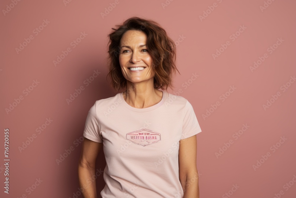 Portrait of a smiling woman in her 40s sporting a vintage band t-shirt against a pastel brown background. AI Generation Portrait of a smiling woman in her 40s sporting a vintage band t-shirt against a pastel brown background. AI Generation