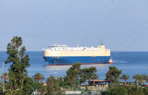 Side view of a big car carrier ship Roll on Roll off entering port