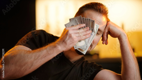Upset man wipe tears with stack of money banknotes sarcastic meme photo