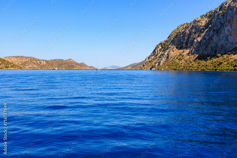 Beautiful nature with sea and mountains. Background with selective focus and copy space