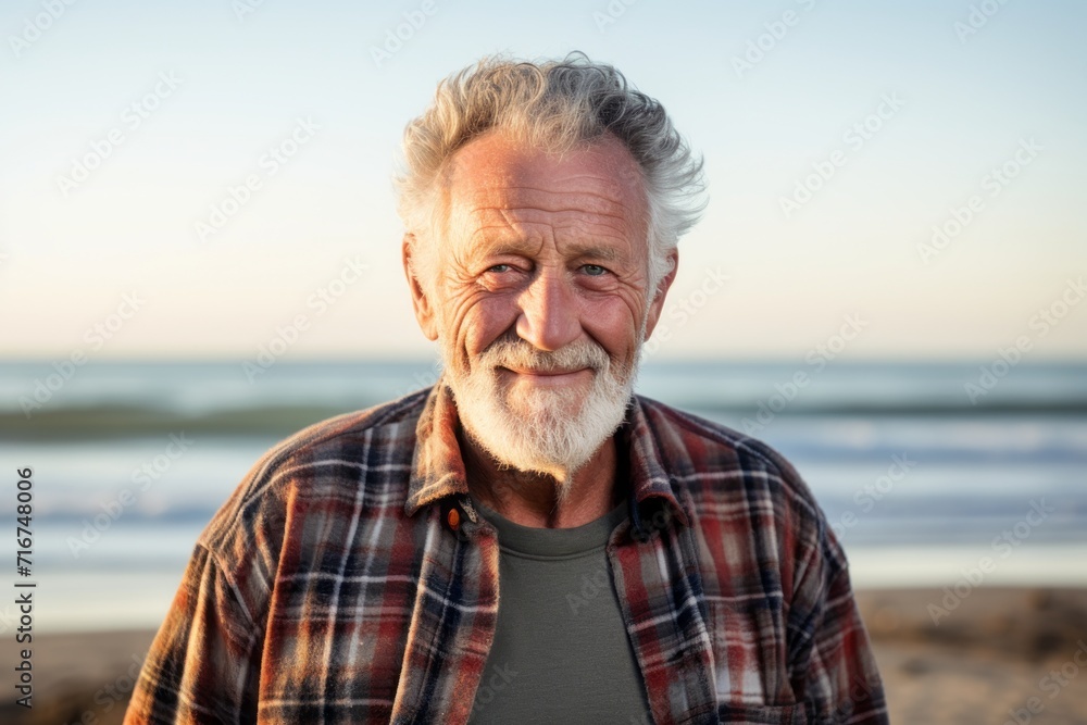 Portrait of a tender man in his 80s dressed in a relaxed flannel shirt against a sandy beach background. AI Generation Portrait of a tender man in his 80s dressed in a relaxed flannel shirt against a sandy beach background. AI Generation