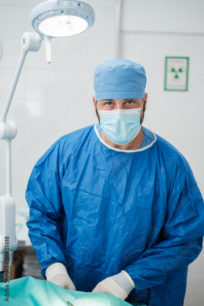 Close-up of a surgeon moments before performing a surgical intervention. Concept: medicine, hospital Close-up of a surgeon moments before performing a surgical intervention. Concept: medicine, hospital