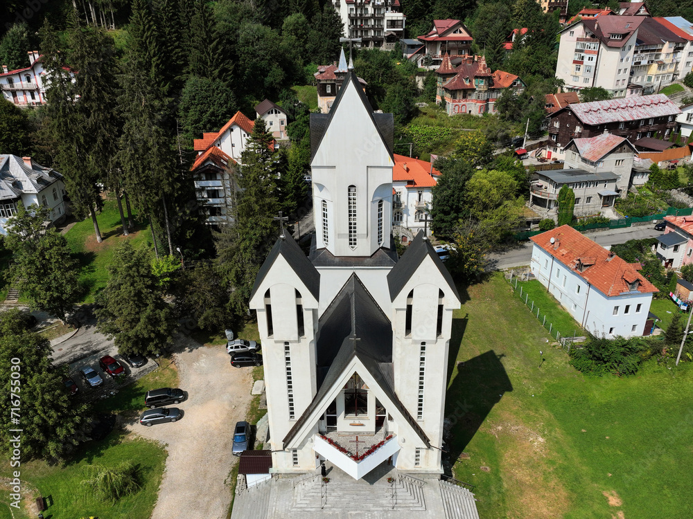 Aerial view showcasing the architectural features of the St. Constantine and Elena Orthodox Church, located in the center of the town of Predeal in Romania.