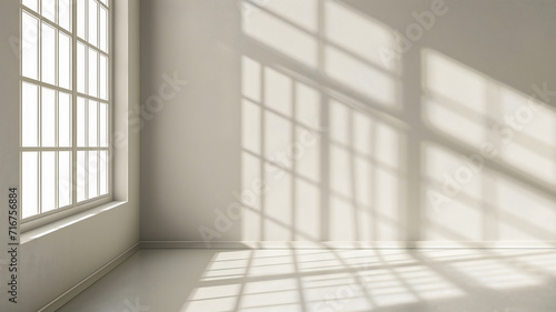 an empty room with the sun beaming in through the window.