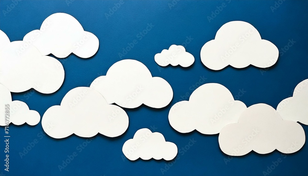 paper clouds in the sky, blue background